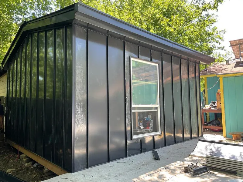 Black standing seam metal wall panels for Roof Inspection in Dumbarton